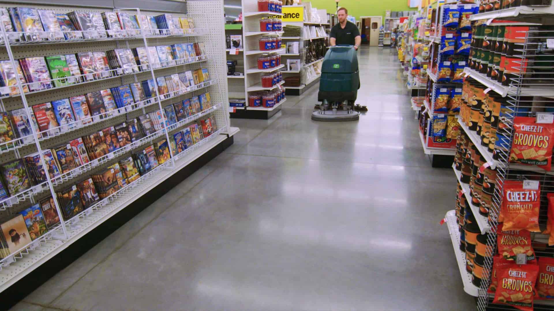 Grocery store aisle with polished concrete floor colored using GemTone Stain Black.