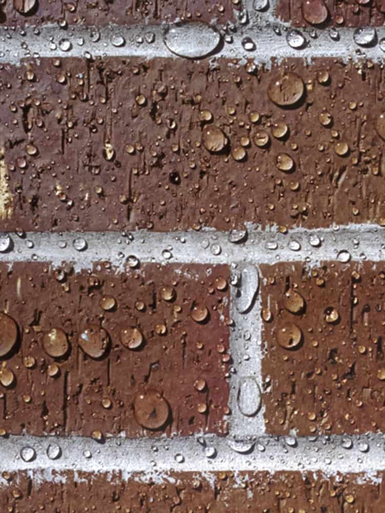 water-beads-on-red-brick