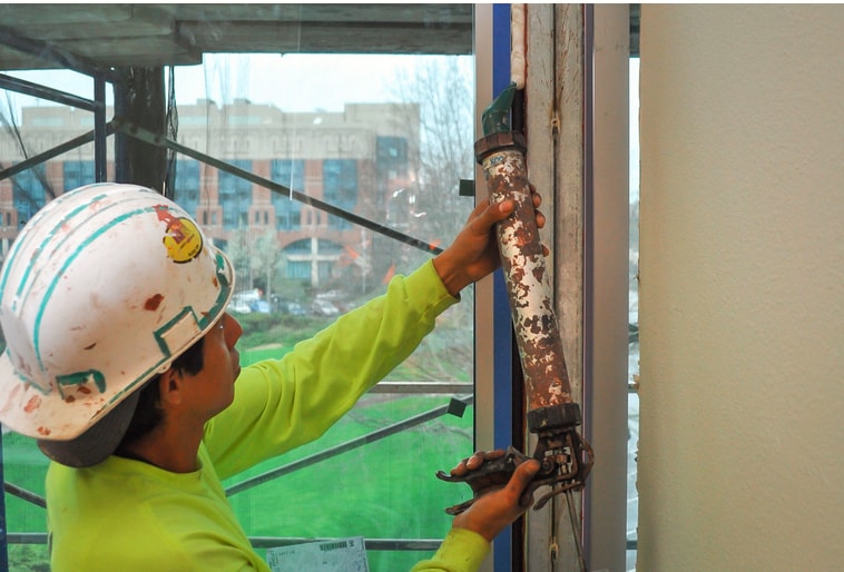 Removing the interior window and door trim will give you the best opportunity to access and seal the space behind the trim. 