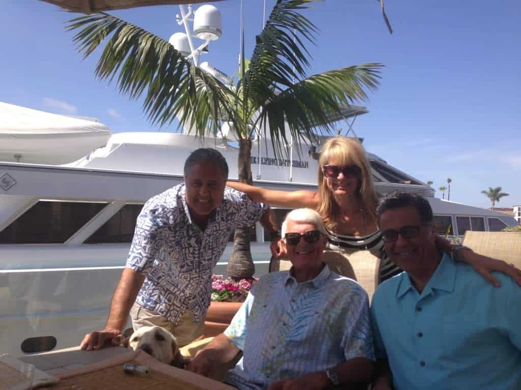 Cor Claus (seated, center) is enjoying a retirement filled with boating and family. 