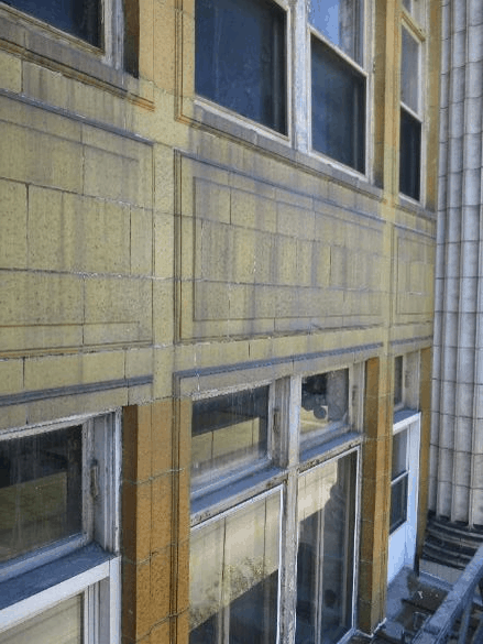 Trials would determine the best solutions to remove the atmospheric stains, biological growth and efflorescence off the facade. Photo courtesy WJE