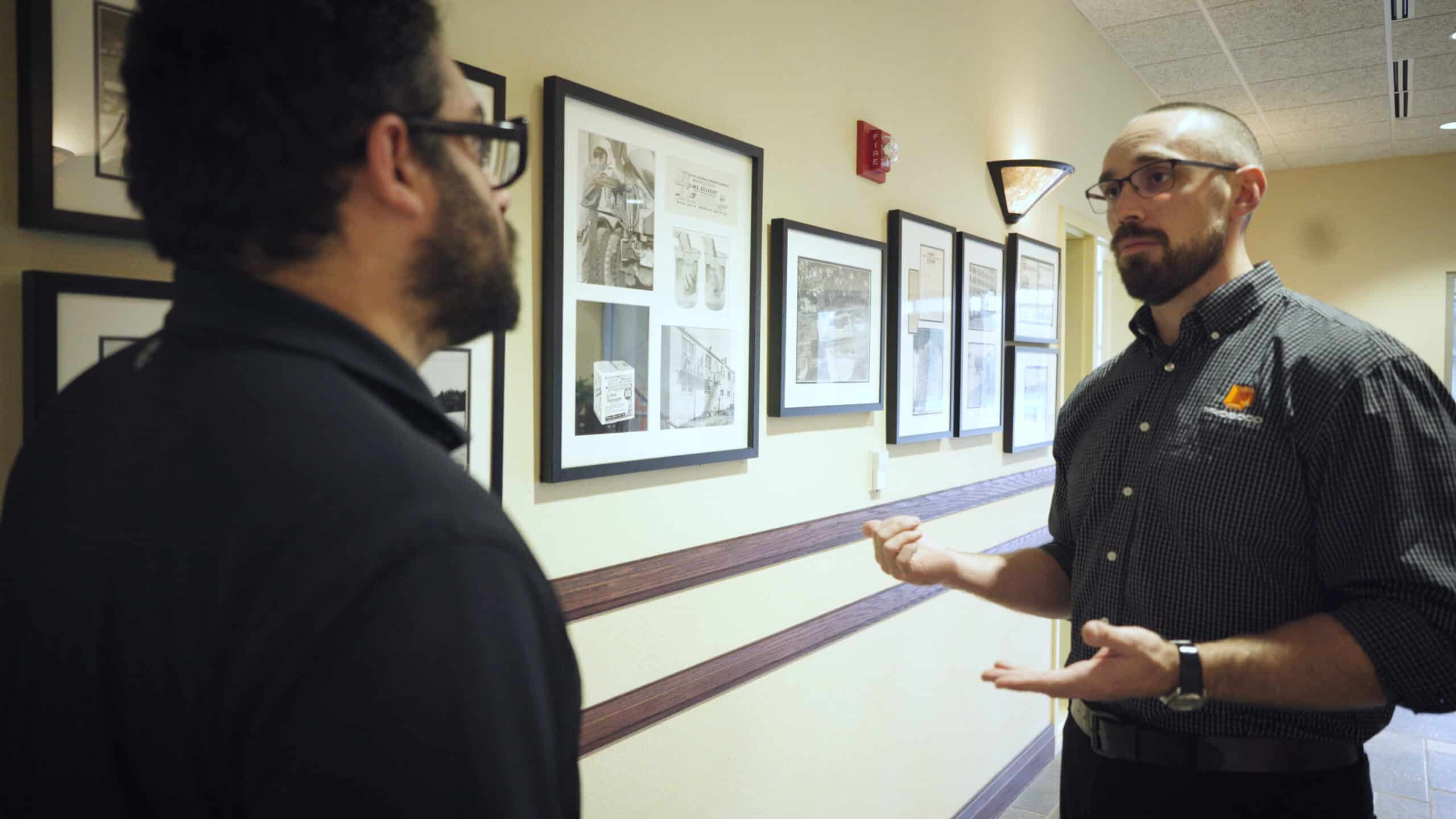 Jake Boyer gives Dan Kamys a tour of PROSOCO headquarters in Lawrence, Kan.