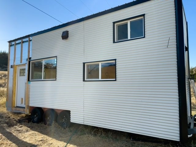 Pictured is Nick's tiny home with the siding nearly completed. 