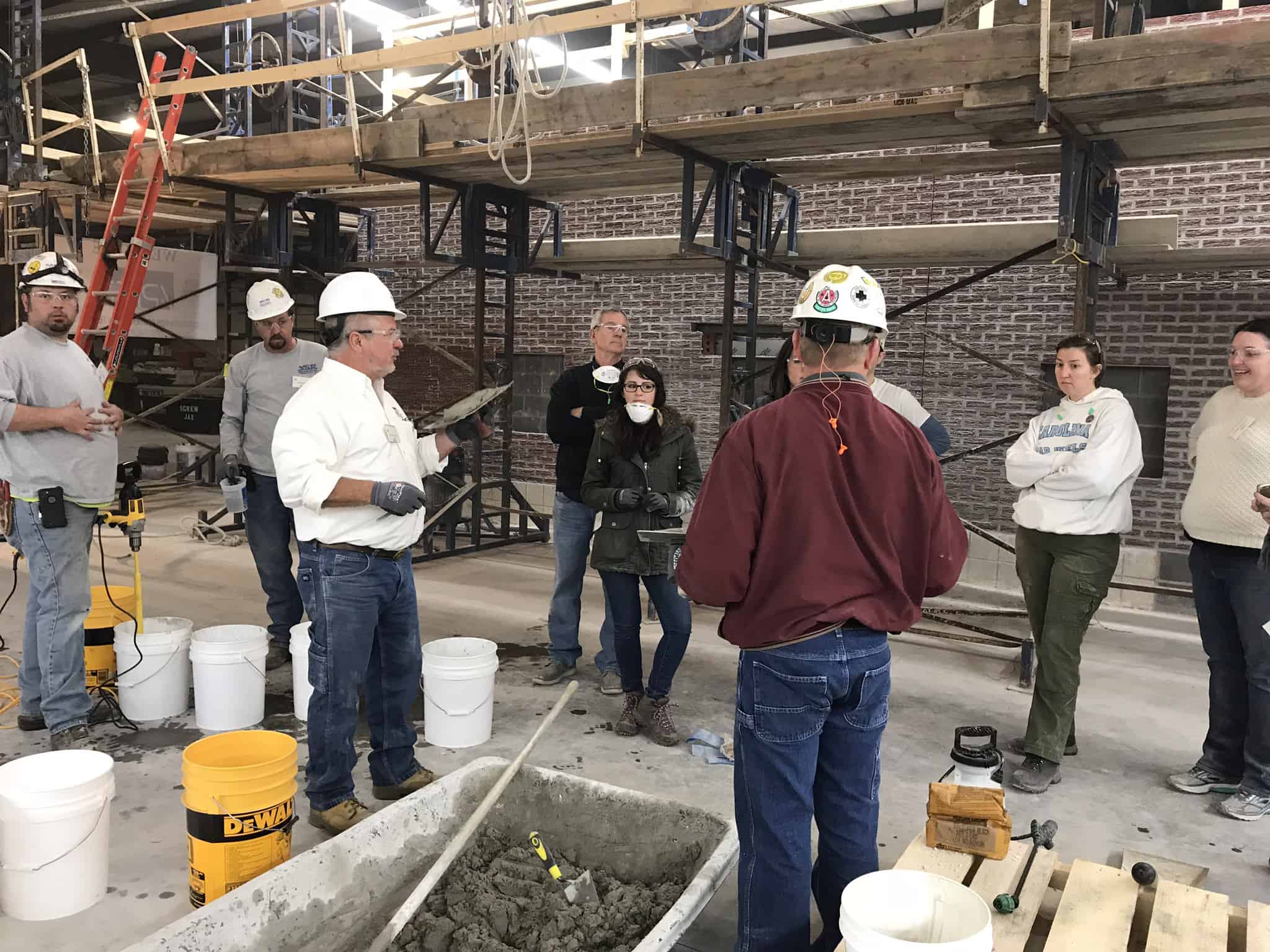 Frank Halsey (left in white) is pictured at the 20,000-square-foot training facility he helped create for Mid-Continental Restoration.