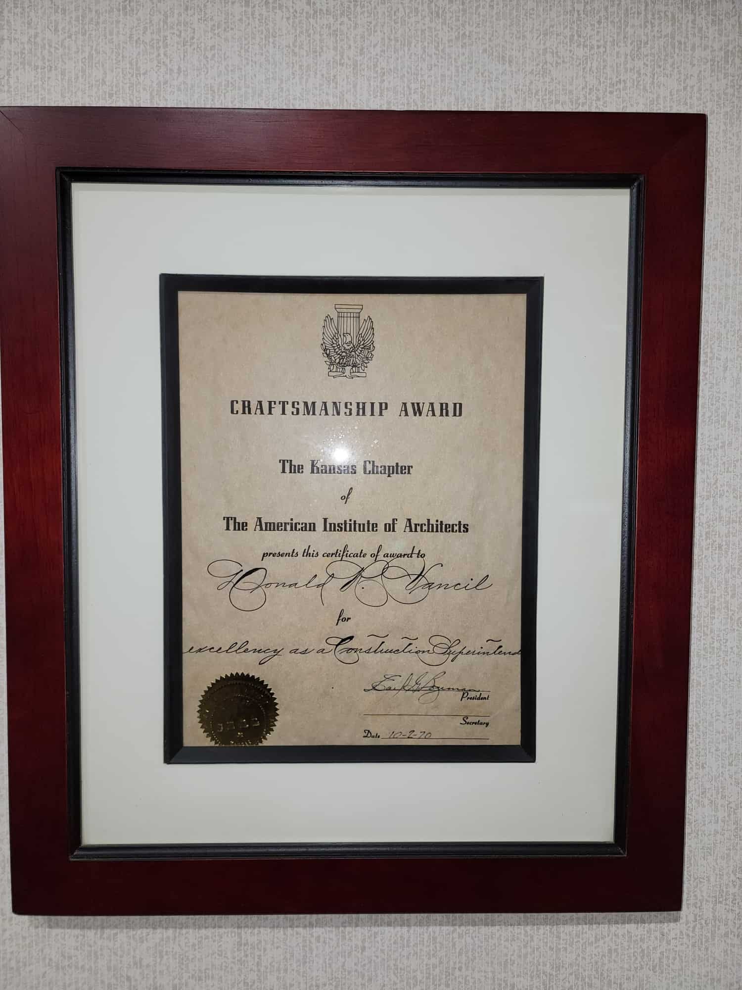 Don Vancil proudly displays in his home a craftsmanship award he received in 1970 from the Kansas chapter of the American Institute of Architects.