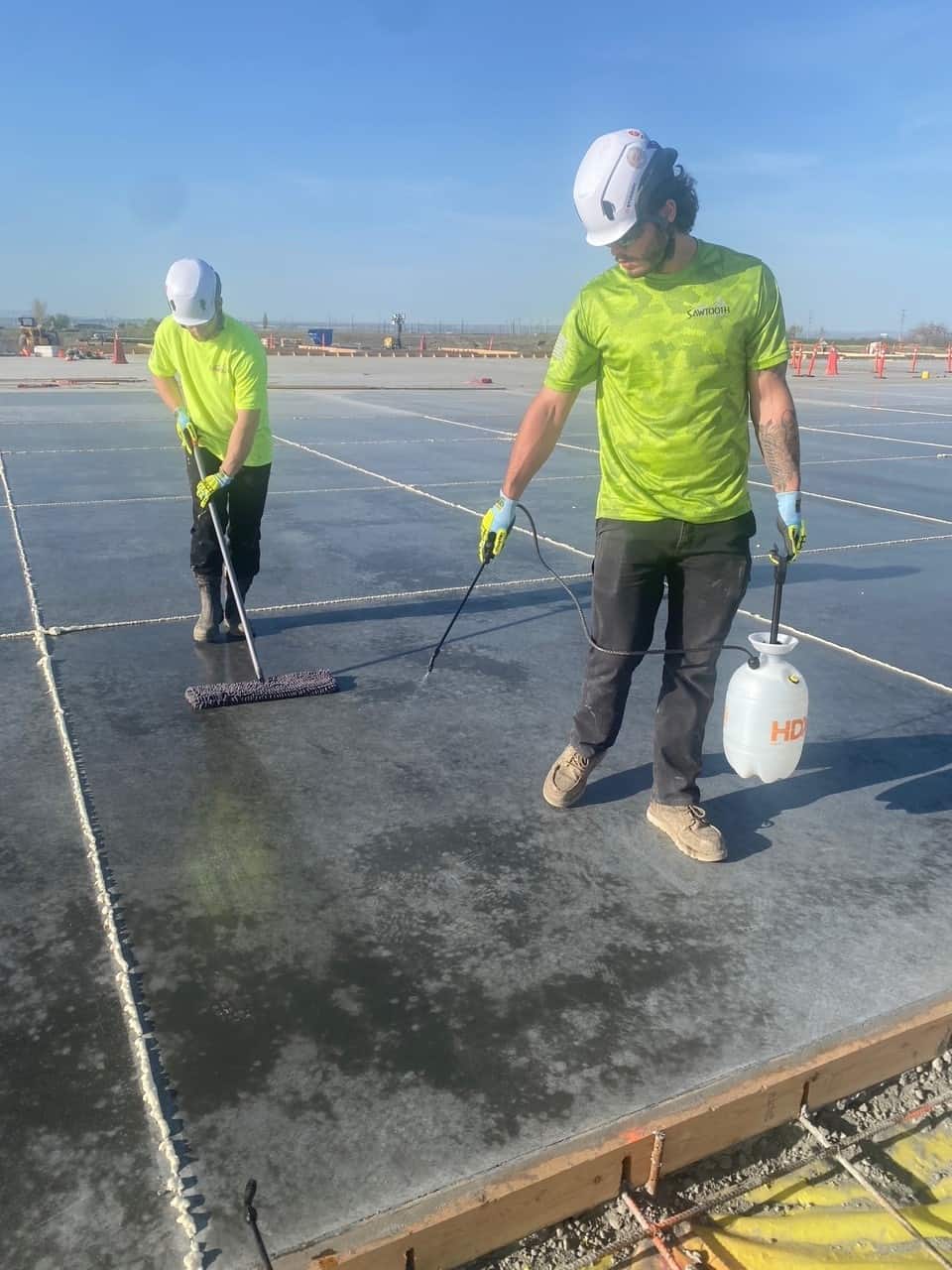 Sawtooth Caulking applies Consolideck products to newly placed concrete