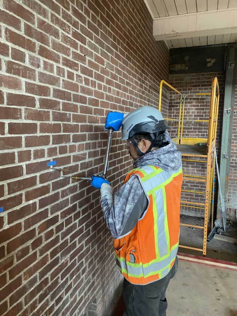 Pull tests were completed on the interior brick wall in 2023 | photo by Matt Herz