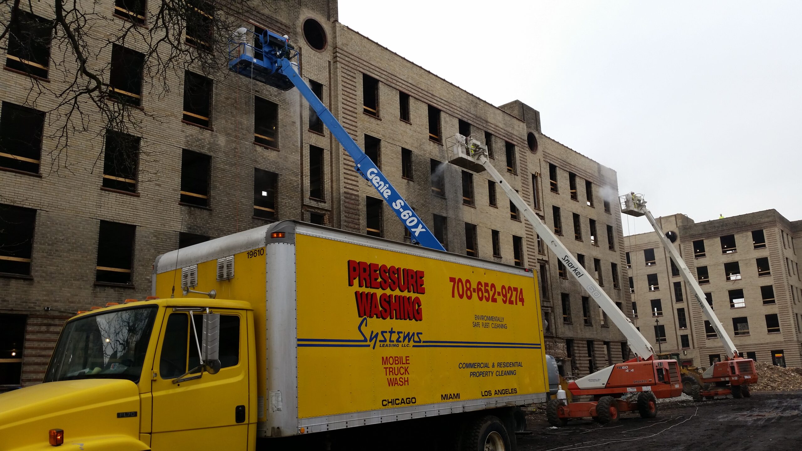 PWS owns a fleet of 40 trucks that are completely self-contained, meaning they can wash a building, pick up the wastewater, treat it on the truck with a sophisticated filtration system, and reuse that water to keep washing the building. Photo courtesy Pressure Washing Systems