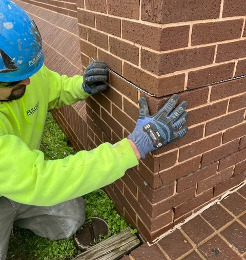 crack-stitching a cracked brick wall in Washington, D.C.