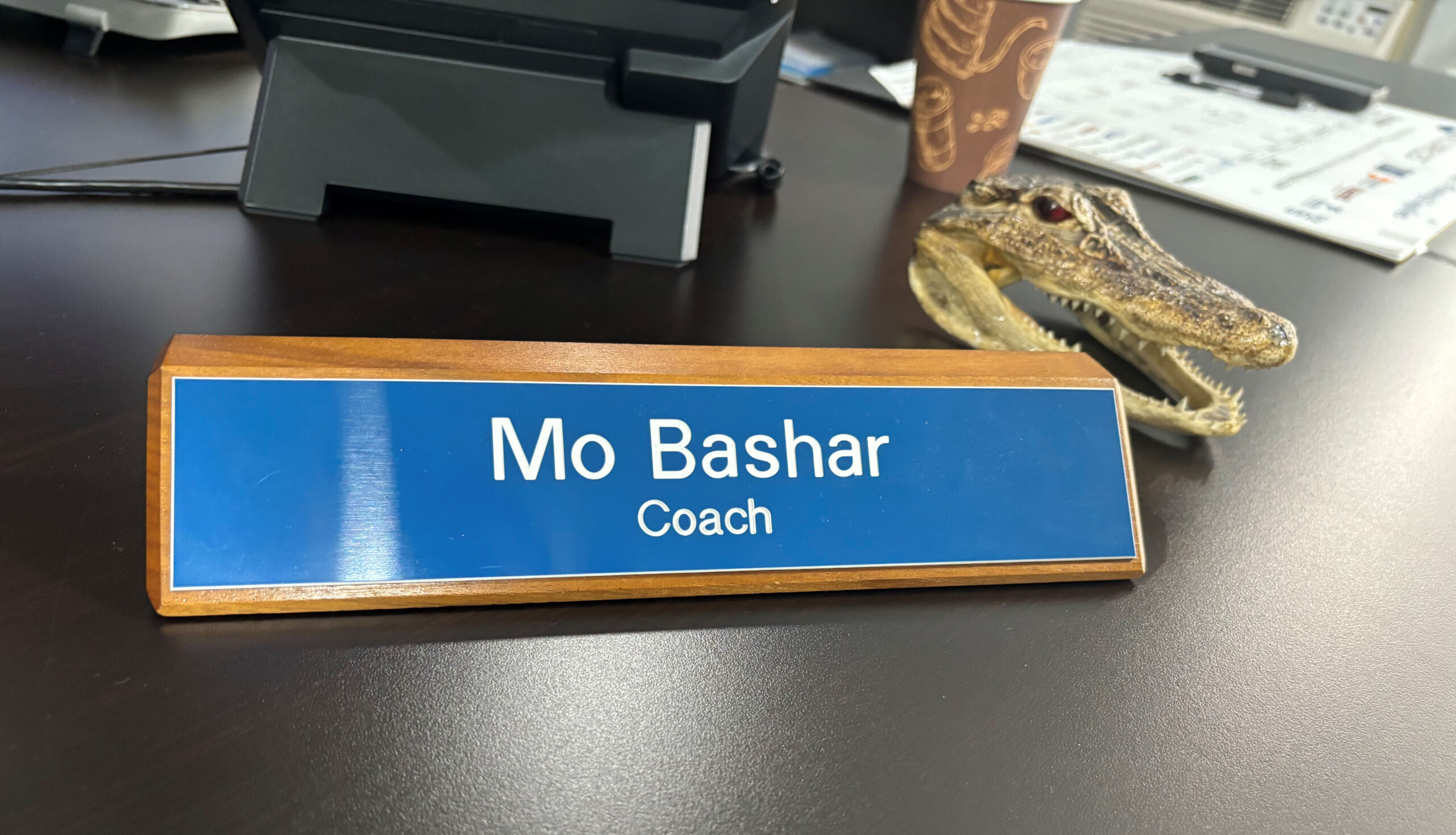 Mo prefers the title of "coach" over owner of the business