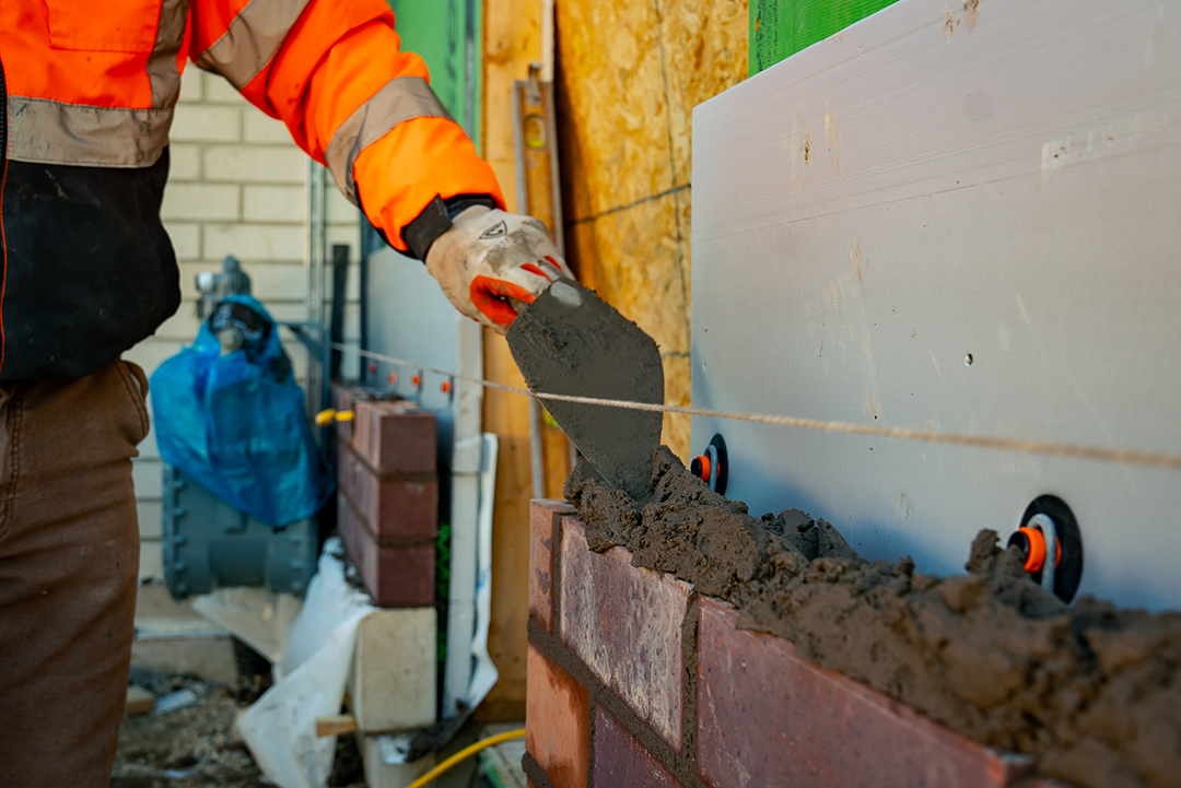 a new brick wall is built at the Mundelein senior apartments in Chicago